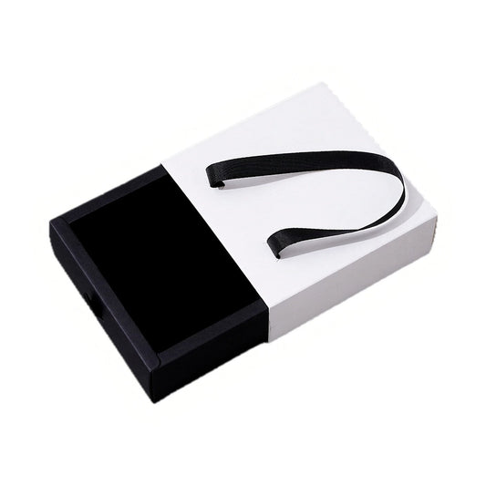 Custom black and white foldable drawer jewelry box with ribbon handle on pure white background