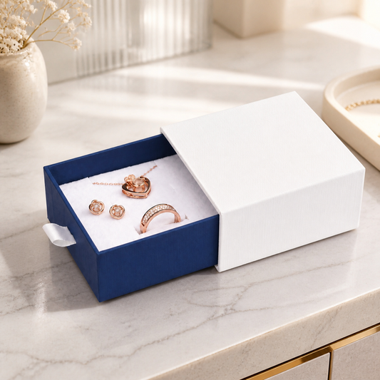 Blue jewelry box with drawer presented in a boutique jewelry-store display scene.