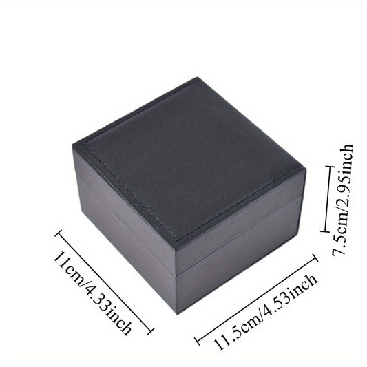 Black one-watch gift case viewed at an angle with a hinged lid and warm brown cushioned interior.