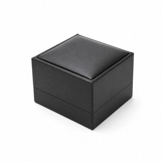 Closed black PU earring box on a white background