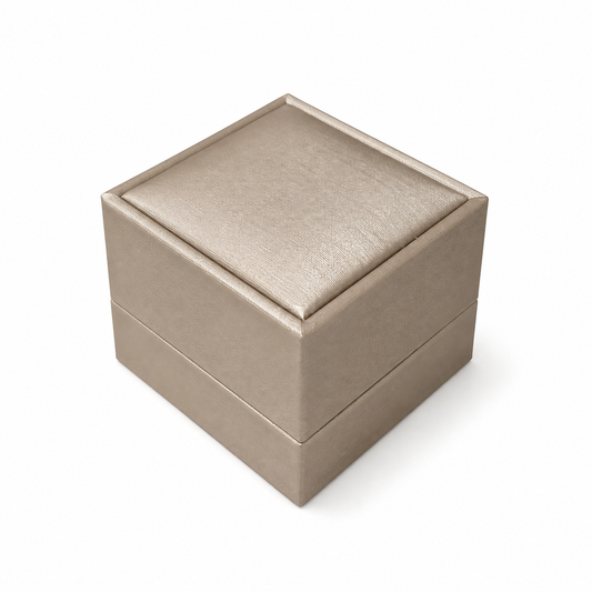 Closed champagne PU earring box on a white background