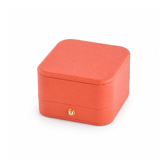 orange PU pendant box, closed exterior in a three-quarter view.