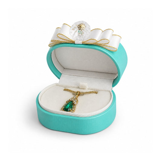 Turquoise pendant box, open to show the fitted interior and jewelry in a three-quarter view.