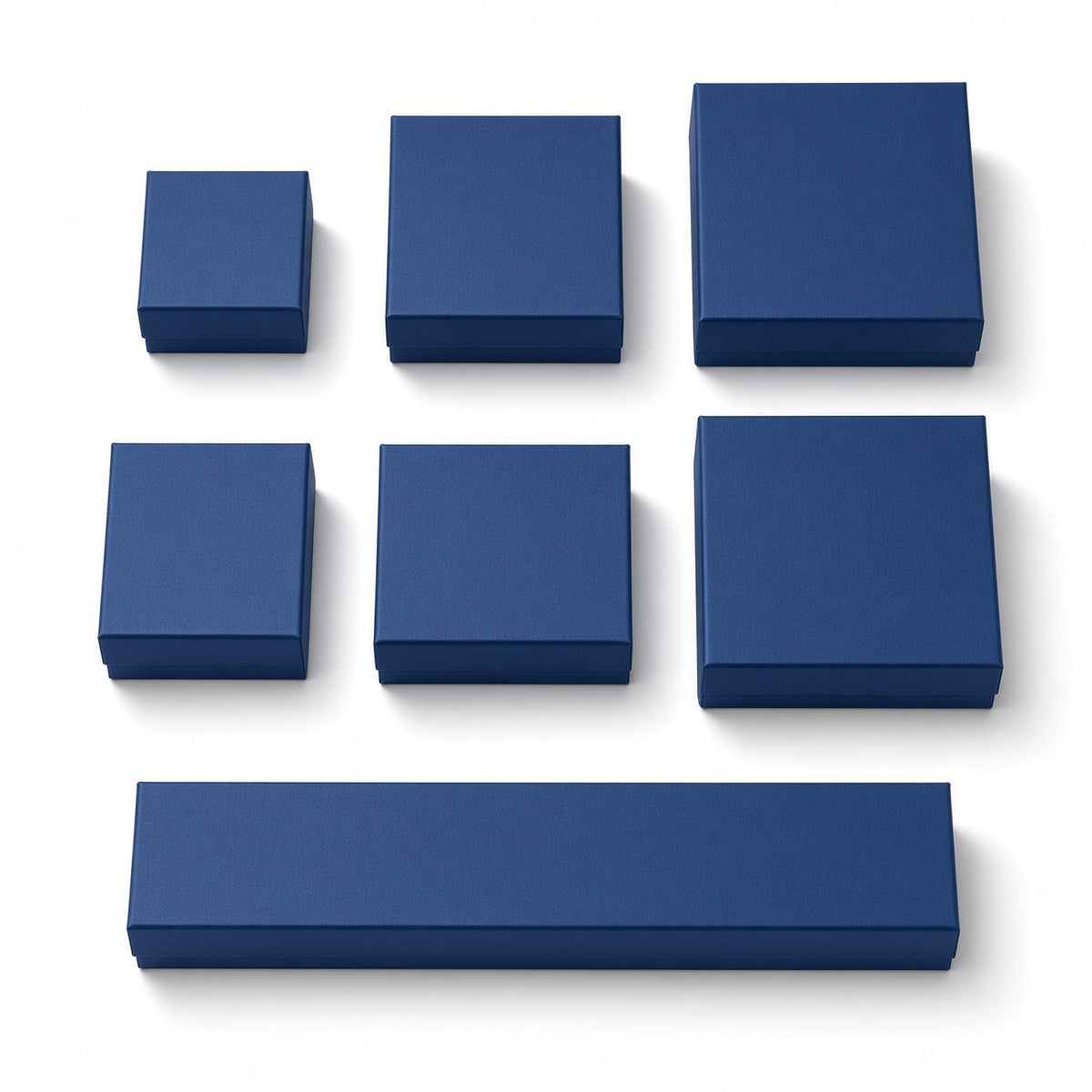 Seven deep navy blue custom magnetic jewelry box sizes on a pure white background