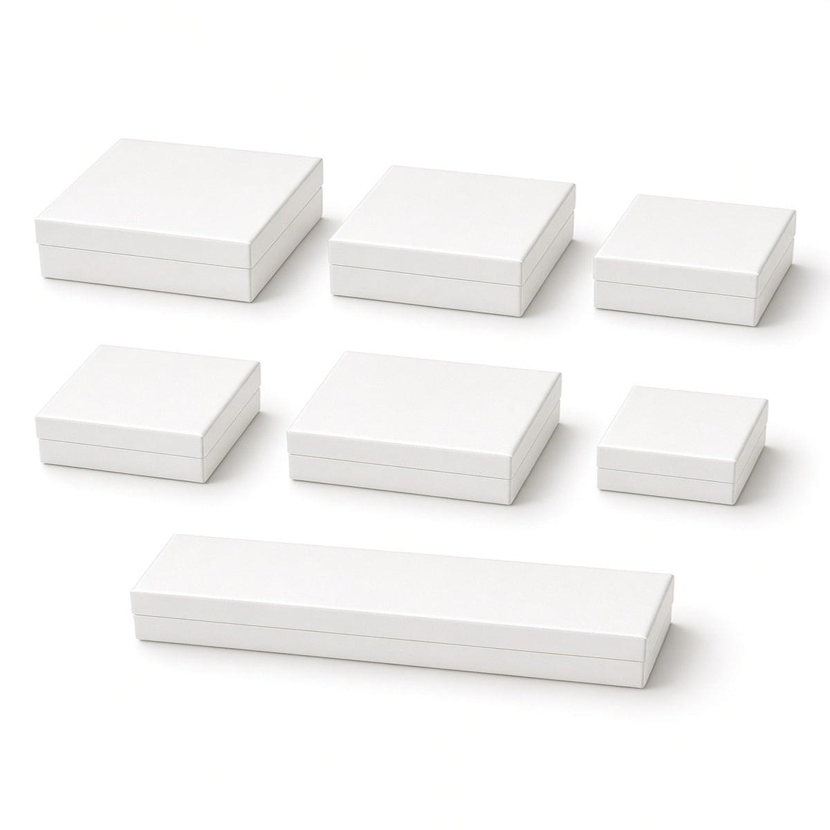 Seven pearl white custom magnetic jewelry box sizes on a pure white background