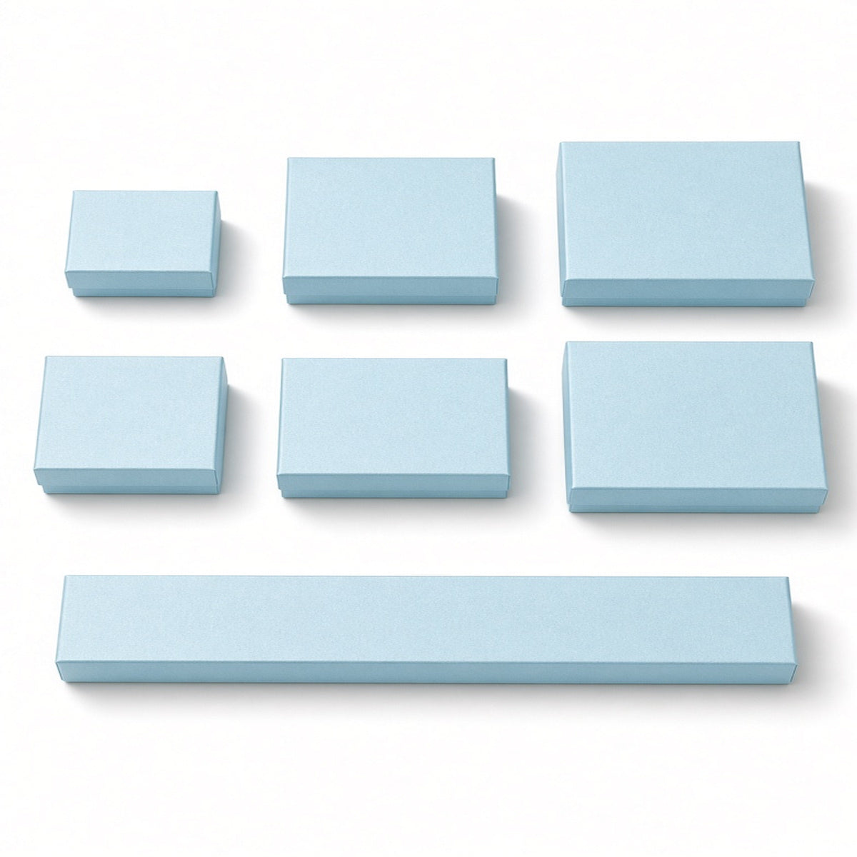 Seven powder blue custom magnetic jewelry box sizes on a pure white background