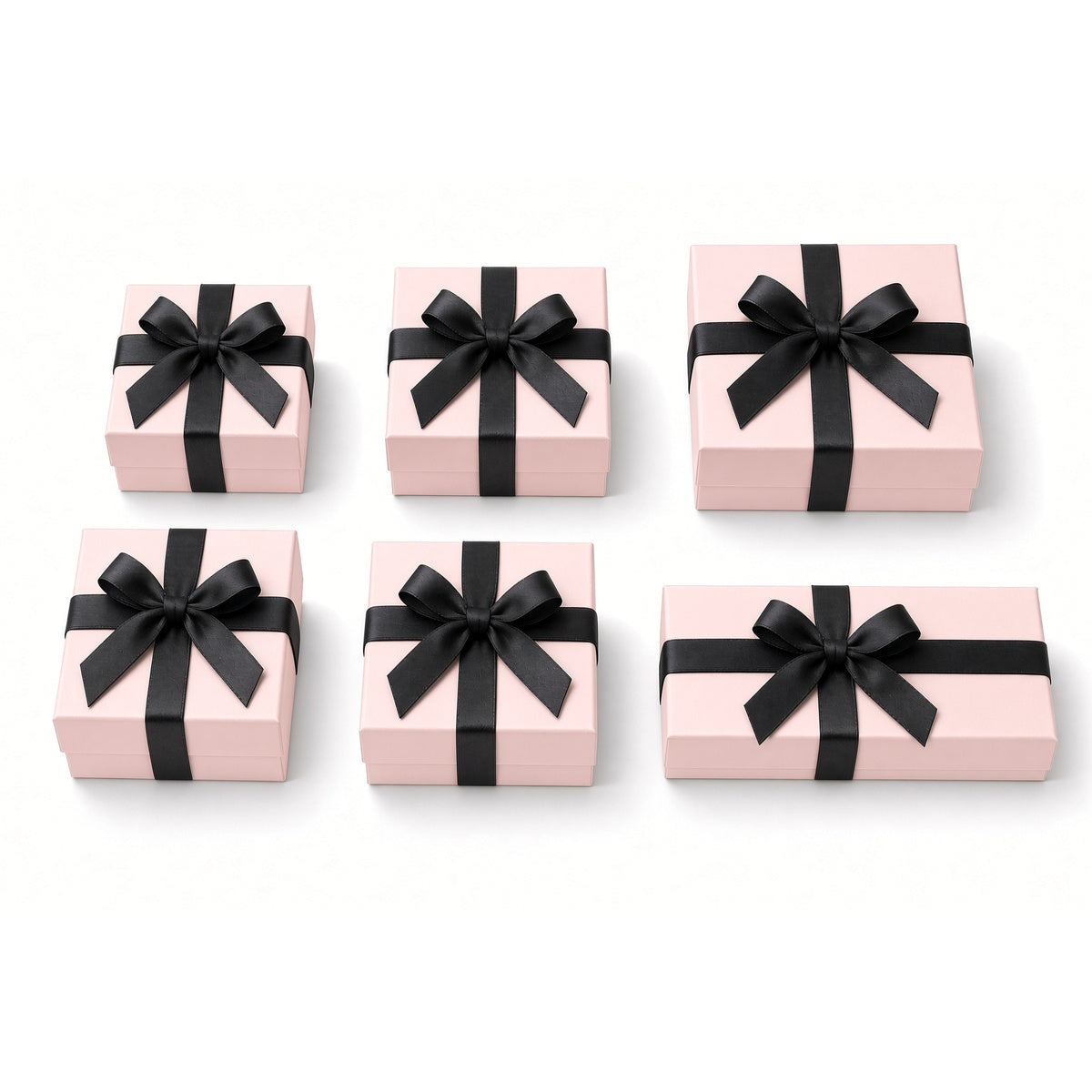 Six pale pink ribbon closure custom jewelry box sizes on white