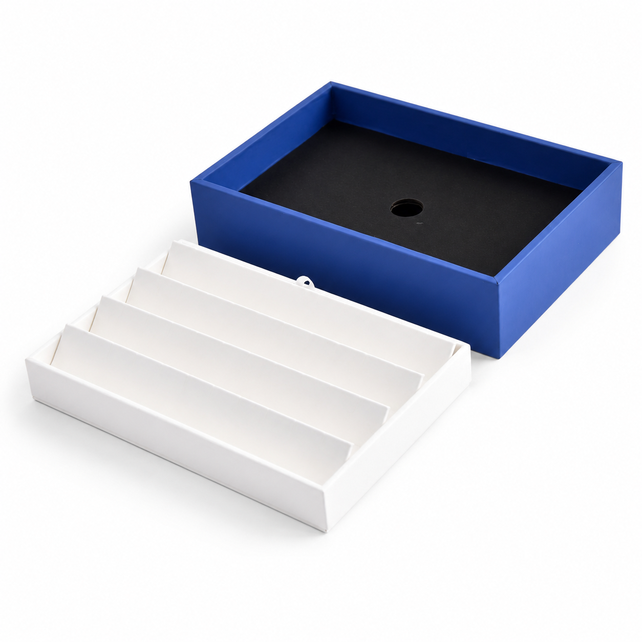 White slanted earring display insert inside a blue jewelry presentation tray