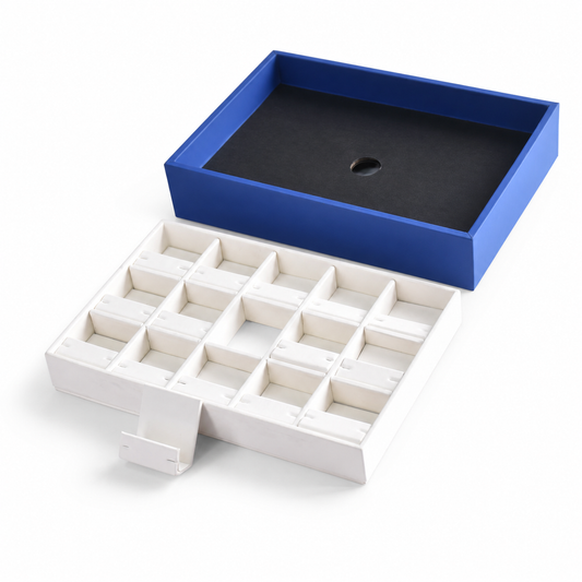 Three-by-five jewelry tray with individual white earring holder compartments