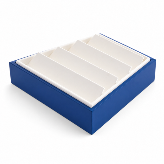 Blue 12-pair slotted earring tray with white insert on a clean white background