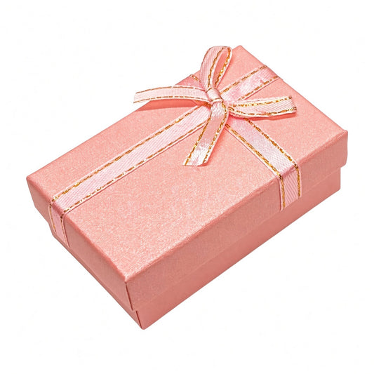 Closed pink B2632 bow jewelry gift box on a pure white background