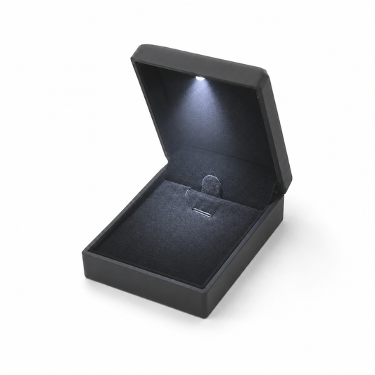 Black LED jewelry box with illuminated lid and soft black interior for elegant jewelry presentation