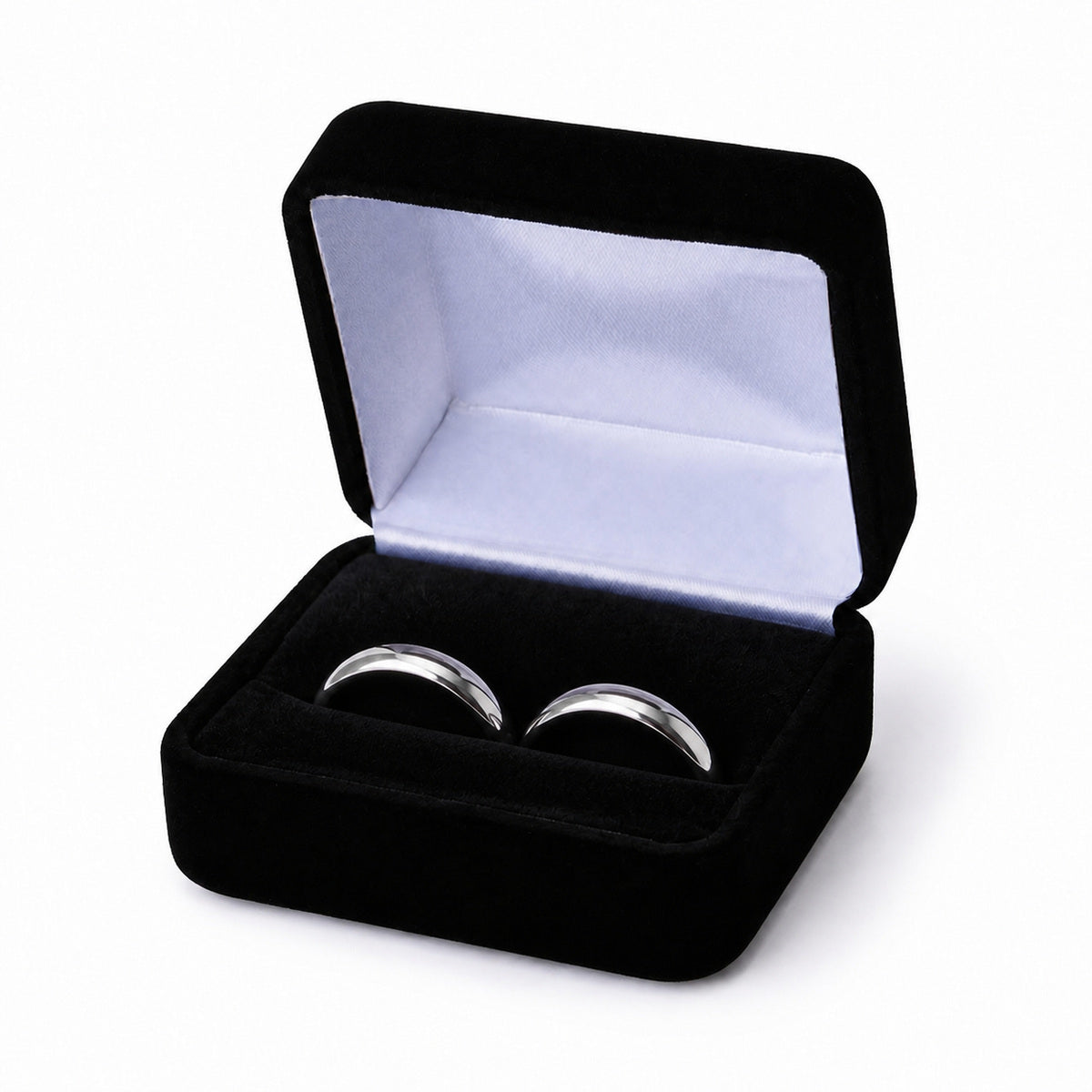 Black velvet double ring box with two silver wedding bands seated side by side.