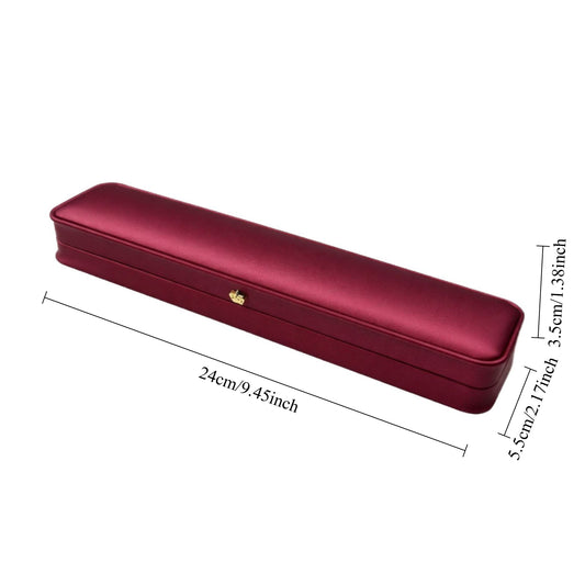 Open burgundy long bracelet presentation box with a light cushioned interior and gold-tone lid ornament.
