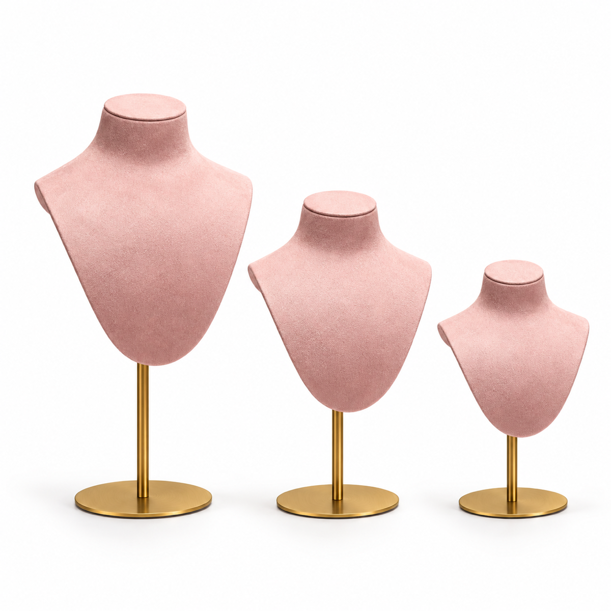 Pink velvet portrait necklace stands with gold bases in three heights on a pure white background