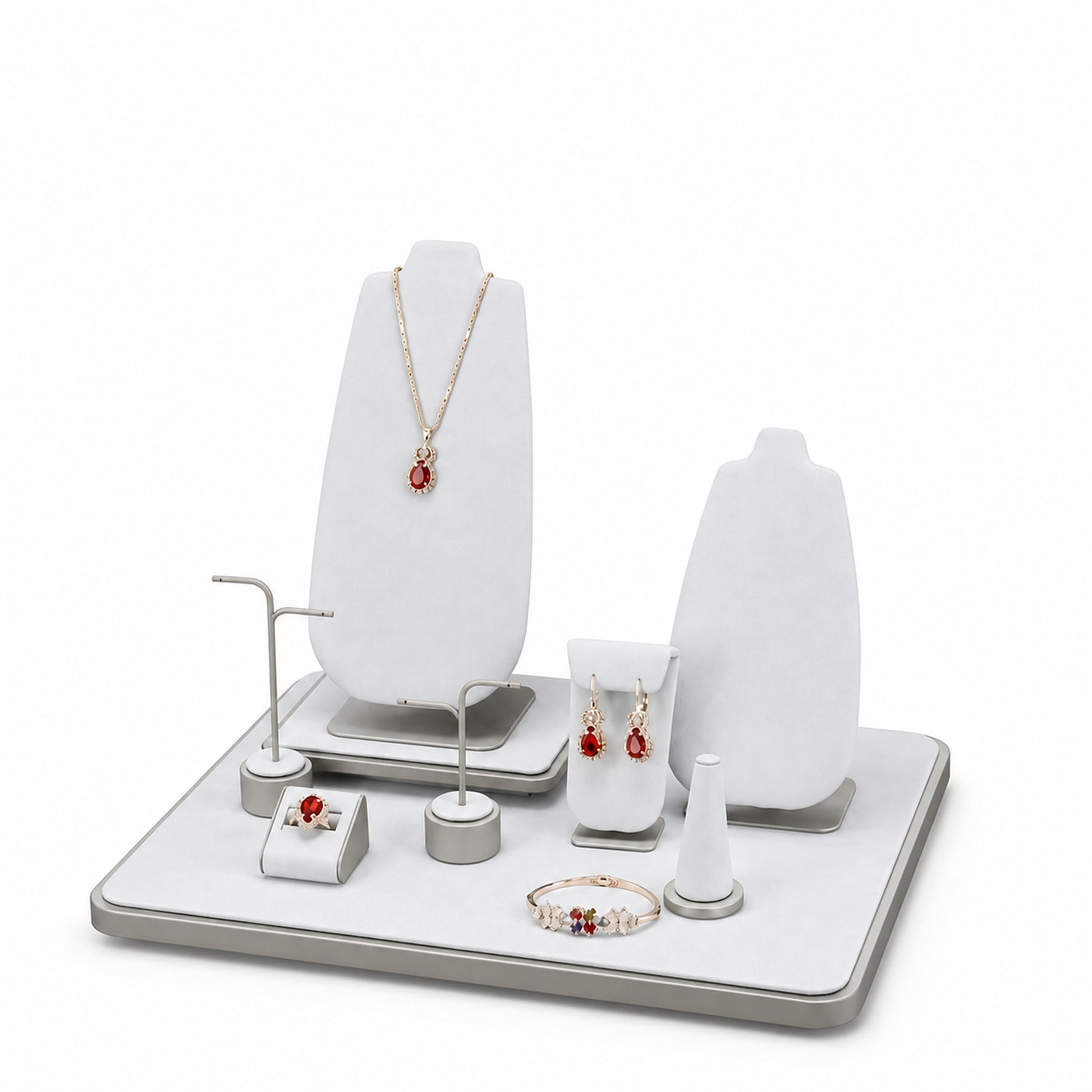 Custom White Geometric Countertop Jewelry Display shown without the backboard in a white and gray arrangement with jewelry visible on the display pieces