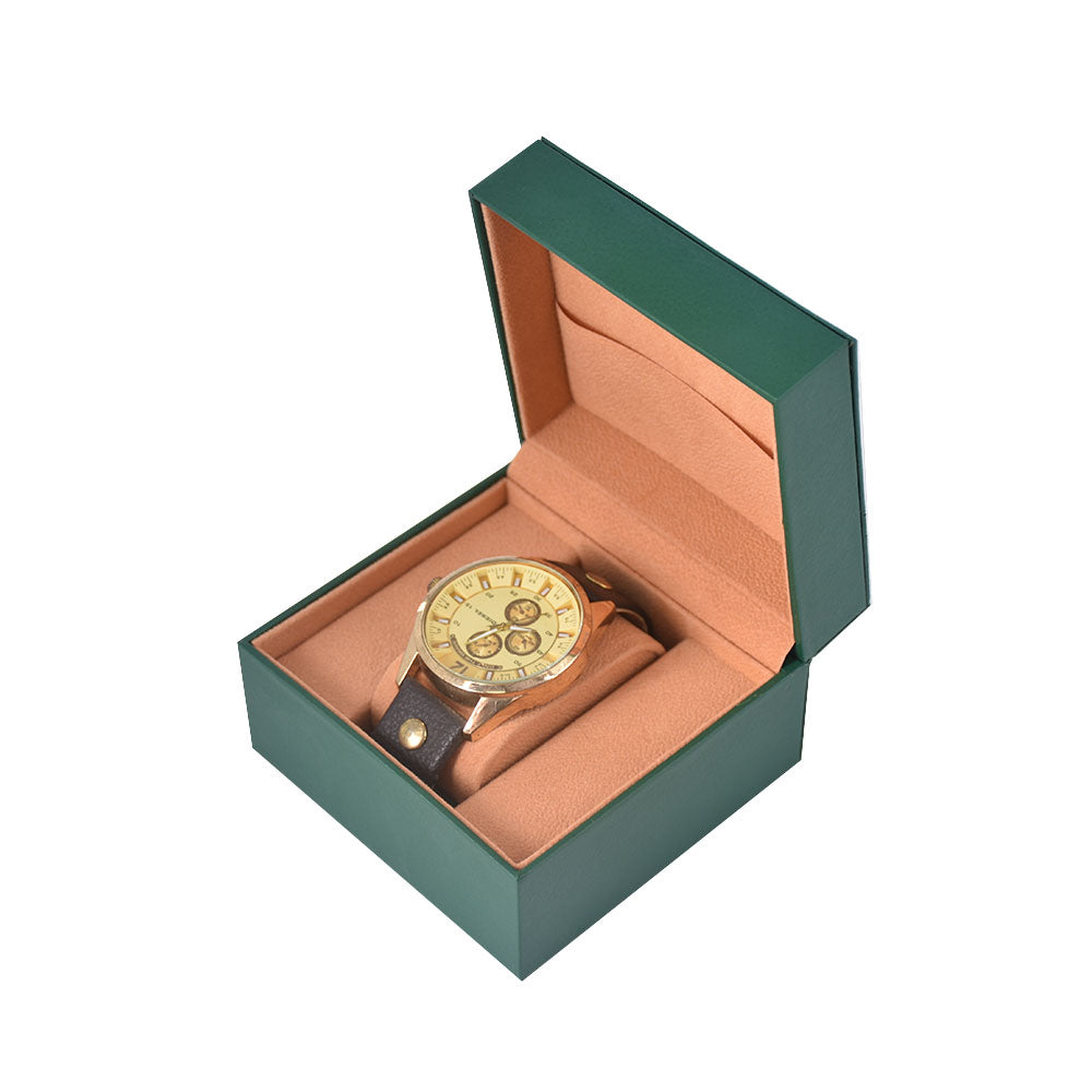 Open green single watch box with a tan cushioned compartment on a white background.