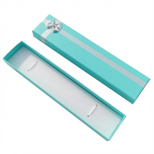 Open lake blue paper bracelet box with silver ribbon bow and white insert