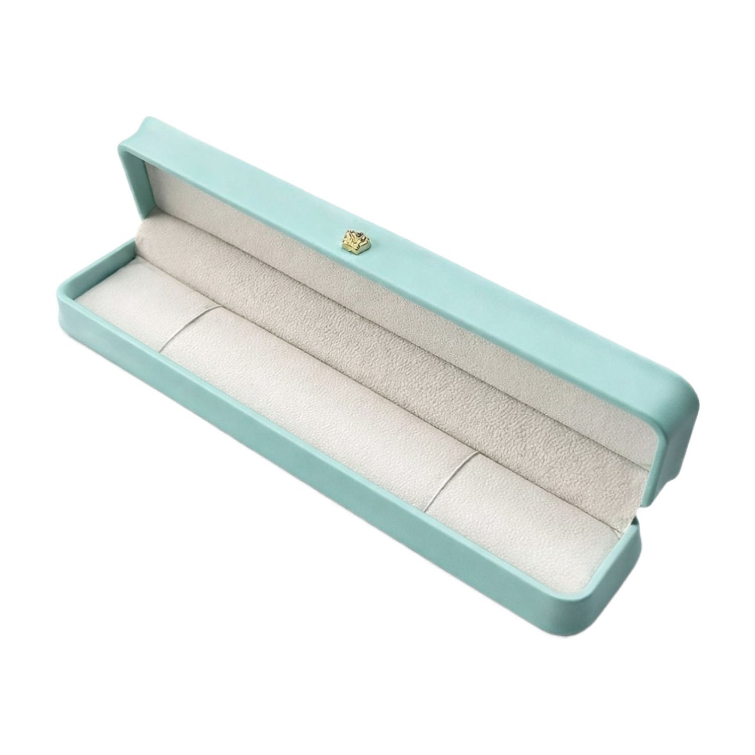Open Tiffany Blue rounded bracelet box with an elongated padded interior and gold-tone lid ornament.