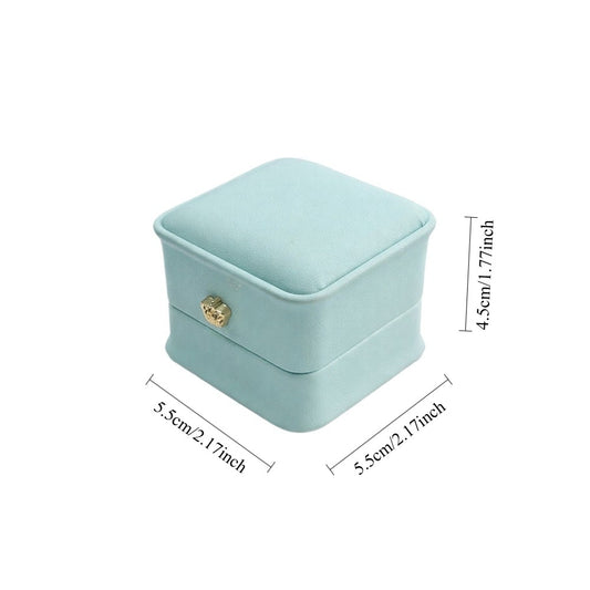 Set of 12 mint ring packaging boxes with hinged lids, padded interiors, and gold-tone decorative accents.
