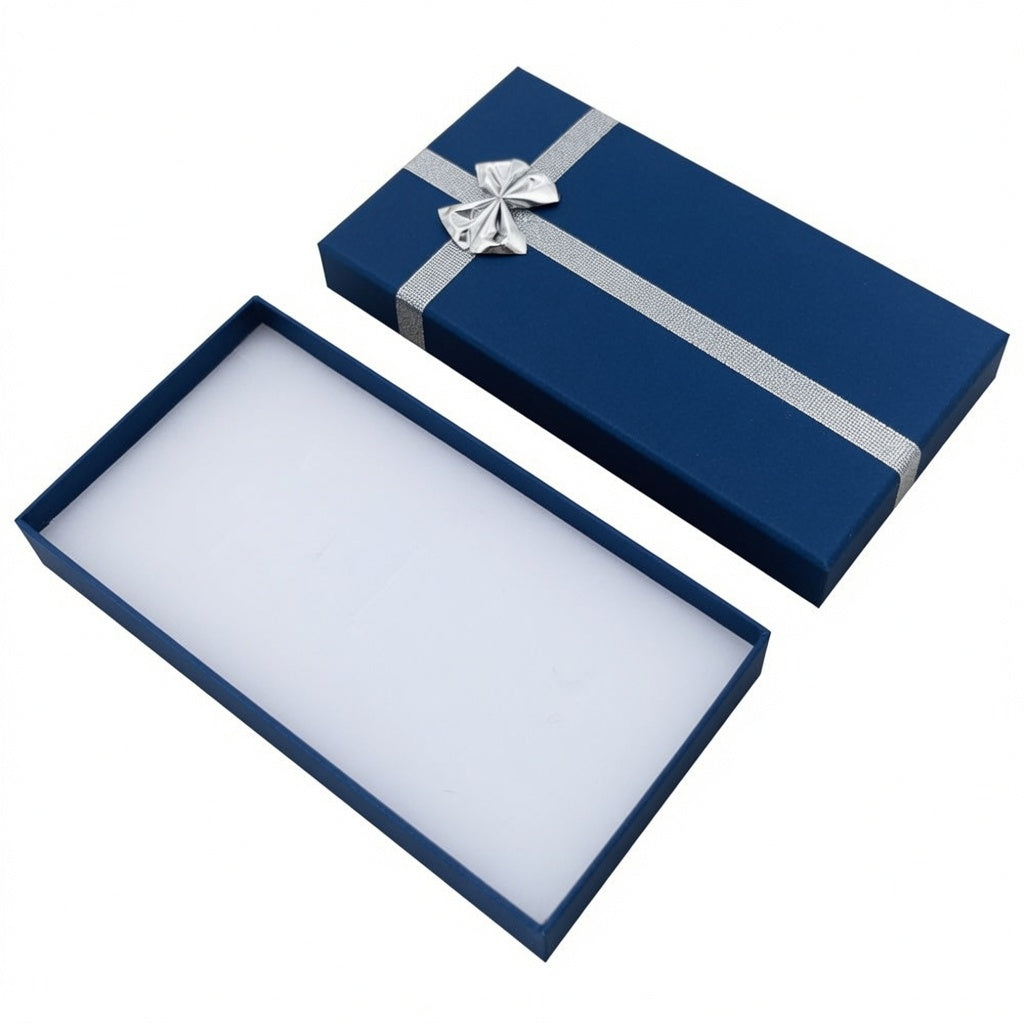 Open navy blue paper necklace box with silver ribbon bow and white insert