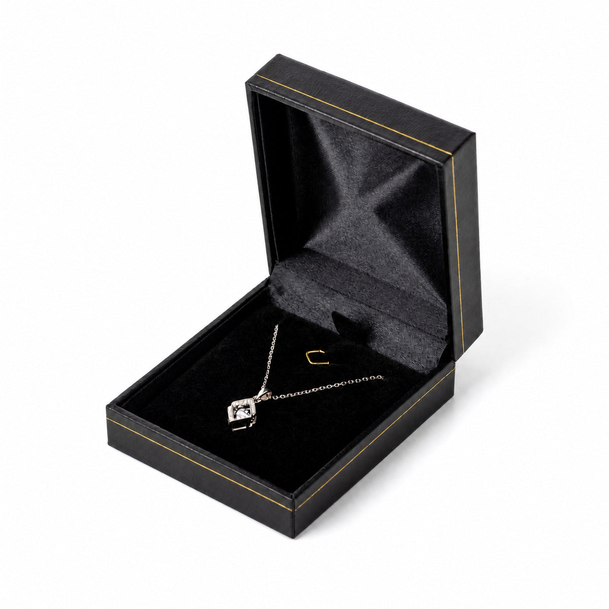 Black necklace box LP9 with gold trim, open in three-quarter view with a pendant necklace.