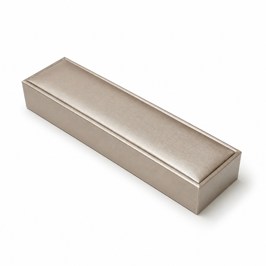 Closed champagne PU bracelet box on a white background