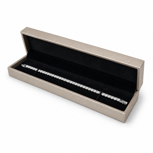 Open champagne PU bracelet box displaying a diamond tennis bracelet