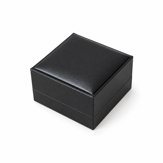 Closed black PU double ring box on a white background
