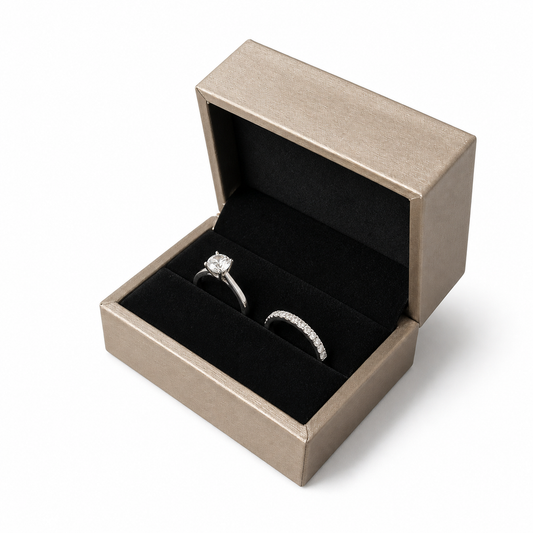 Open champagne PU double ring box displaying two wedding rings