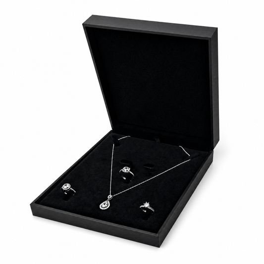 Black PU jewelry set box open in three-quarter view with necklace and rings