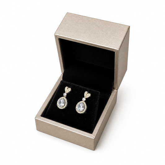 Open champagne PU earring box displaying diamond drop earrings