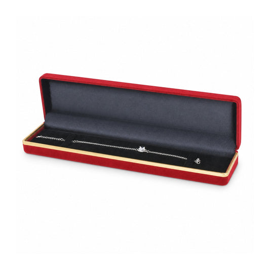 Red flocked bracelet box with gold trim open with silver bracelet.
