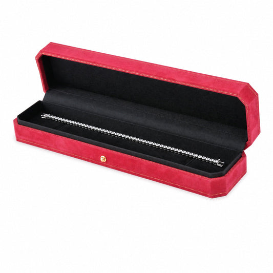 One open red octagonal velvet bracelet box displaying jewelry
