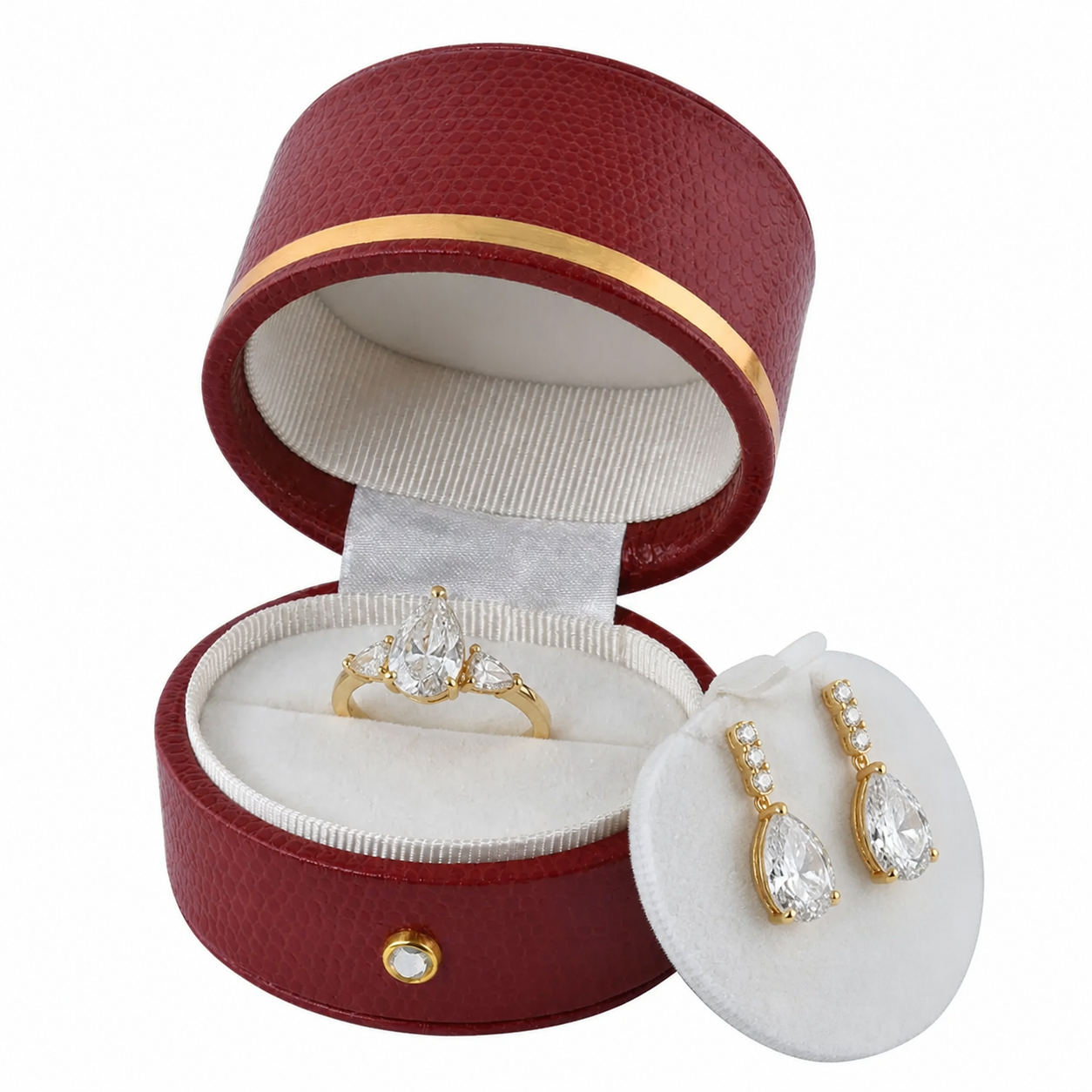 Red oval luxury ring box with pear diamond wedding ring and matching drop earrings