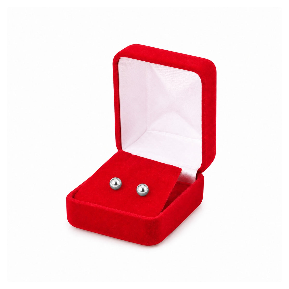 Red velvet earring box open with silver ball stud earrings.