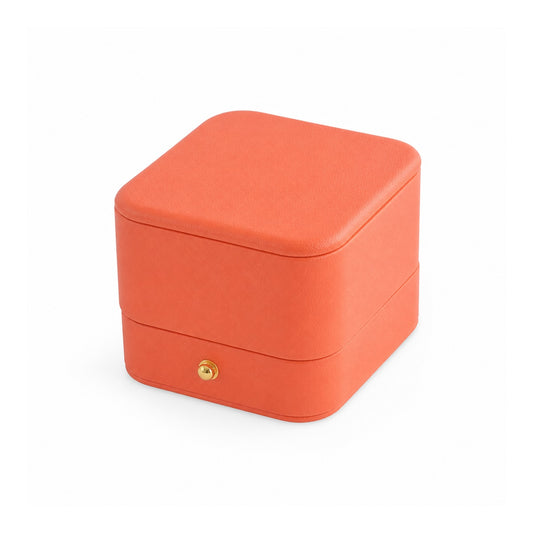 orange PU ring box, closed exterior in a three-quarter view.