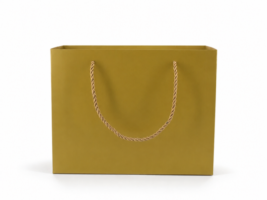 Front view of gold jewelry store gift tote bag with rope handles, 10.25 × 4.25 × 7.75 in