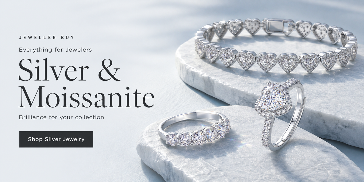 Silver and moissanite heart bracelet and rings on pale blue display platforms, Jeweller Buy — Everything for Jewelers