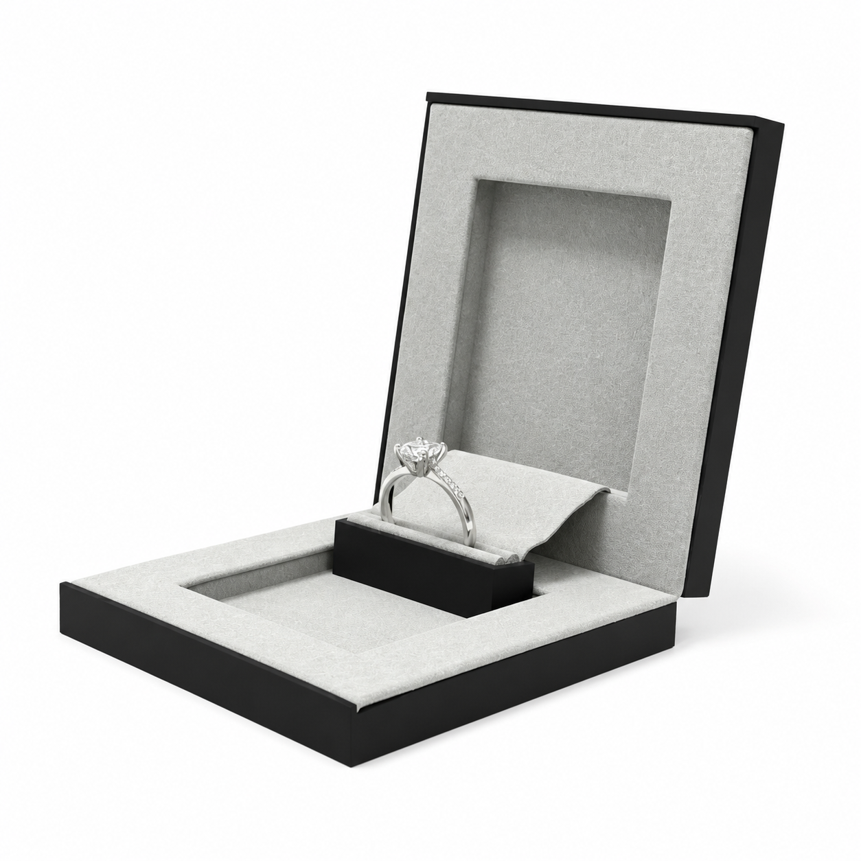 Ultra-thin black ring box open with diamond ring, front three-quarter view